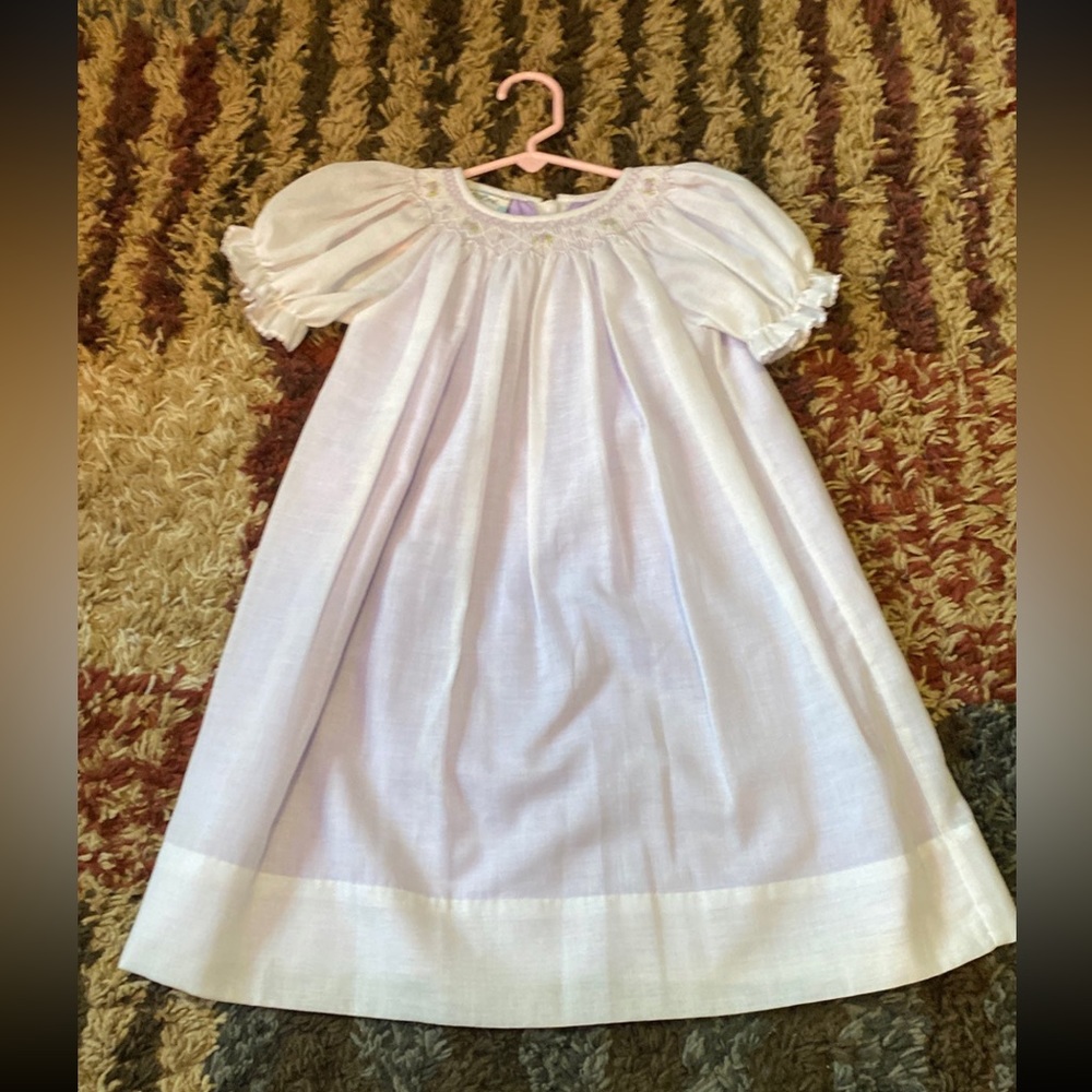 Beautiful cream color smocked dress with purple underlay